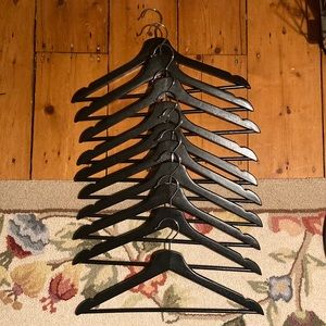 Set of 10 painted wooden clothes hangers in excellent condition